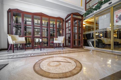 a room with a table and chairs in a store at Oğlakcıoğlu Park Otel in Izmir