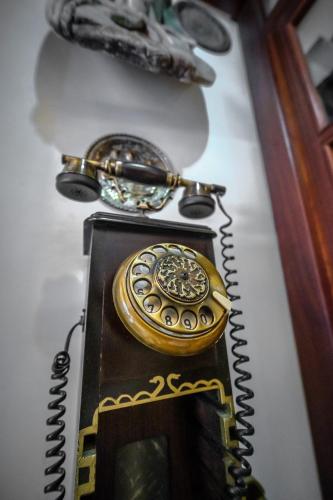 a gold pocket watch sitting on top of a table at Oğlakcıoğlu Park Otel in Izmir