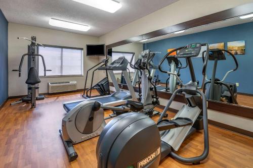 a gym with several tread machines in a room at Comfort Suites Columbus West - Hilliard in Columbus