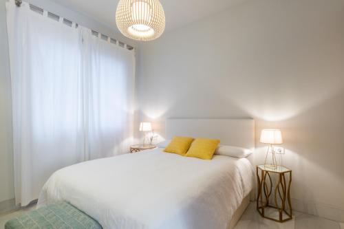 Posteľ alebo postele v izbe v ubytovaní Pinar Vip Class Malaga C/Alcazabilla