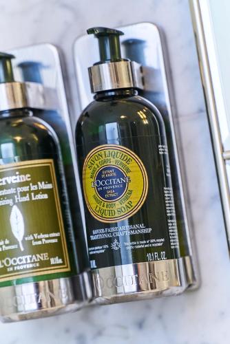 a couple of bottles of soap sitting next to each other at Hotel Monopol - Central Station in Frankfurt/Main