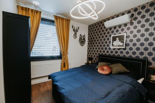 Tempat tidur dalam kamar di Apartmány Evia clinic