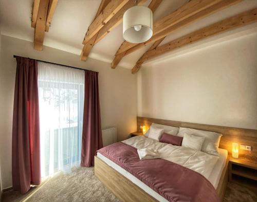 Postel nebo postele na pokoji v ubytování Apartments Severka - Jasná