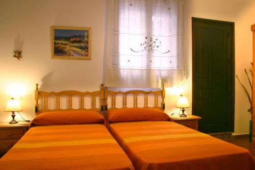 Кровать или кровати в номере Casa Rural Arados