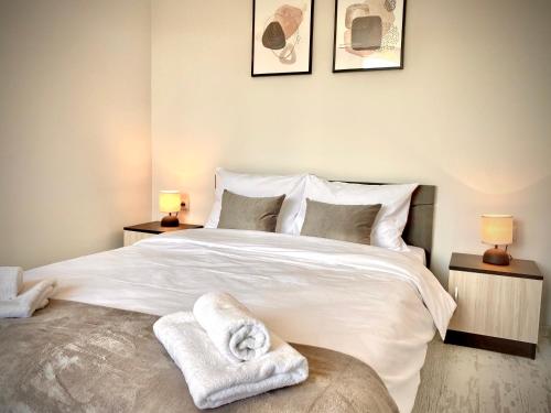 Ένα ή περισσότερα κρεβάτια σε δωμάτιο στο Cozy & Modern 1BR Apart for 4 guests next to Medical University & Free parking