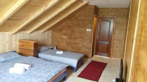 Llit o llits en una habitació de Etno selo ŽURIĆ