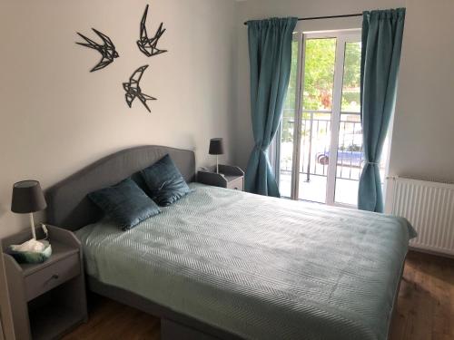 Postel nebo postele na pokoji v ubytování Apartament Baltic Residence Pobierowo