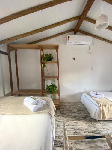 Ένα ή περισσότερα κρεβάτια σε δωμάτιο στο Pousada Cocar Caraíva