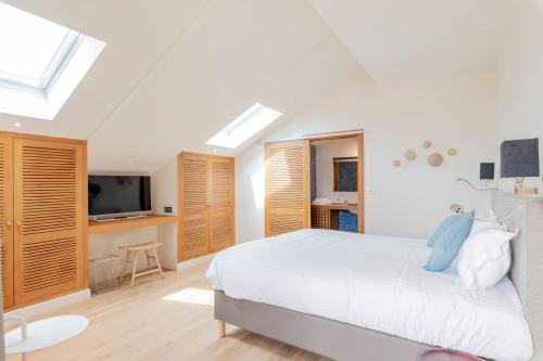 Ένα ή περισσότερα κρεβάτια σε δωμάτιο στο Résidence Les Suites du Port