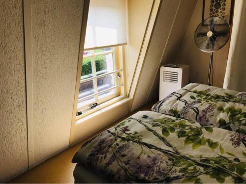 Ένα ή περισσότερα κρεβάτια σε δωμάτιο στο Huisje De Koning