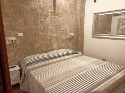 Ένα ή περισσότερα κρεβάτια σε δωμάτιο στο Maison Gioberti