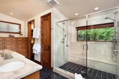 a bathroom with a shower and a sink at Top of Lemond Home in Snowmass Village