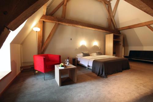 Ένα ή περισσότερα κρεβάτια σε δωμάτιο στο Hotel The Lodge Heverlee