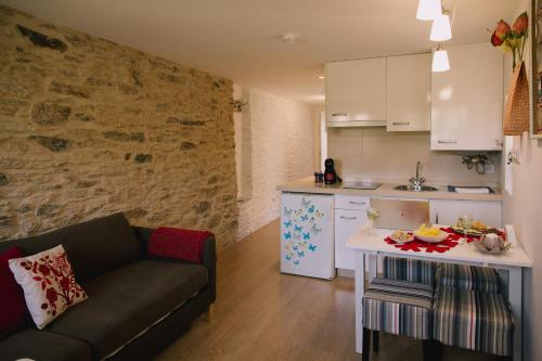 Η κουζίνα ή μικρή κουζίνα στο roomPEDRA apartamentos turísticos