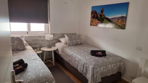 Posteľ alebo postele v izbe v ubytovaní Mar Paraiso