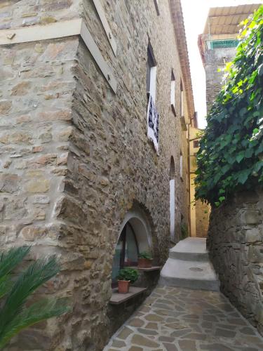 an alley in an old stone building at B&B La Carosella in Vatolla