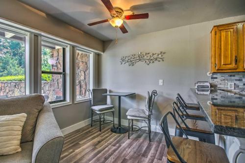 a living room with a couch and a table and chairs at Pool Access Condo with Patio in Afton in Afton
