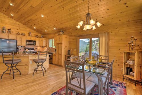a dining room and kitchen with a table and chairs at Cripple Creek Mtn Getaway with Panoramic Views in Cripple Creek