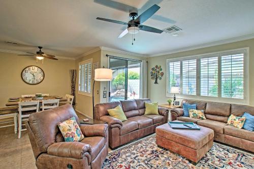 a living room with leather couches and a table at Game Room, Fenced Yard Estrella Oasis in Goodyear in Liberty
