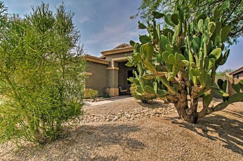 a house with two trees in front of it at Game Room, Fenced Yard Estrella Oasis in Goodyear in Liberty