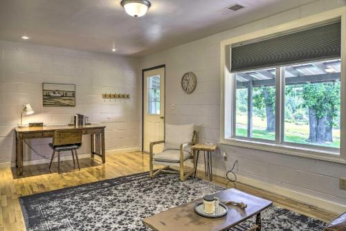 a living room with a desk and a window at Quiet Country Home in Ava with Chic Interior! in Ava