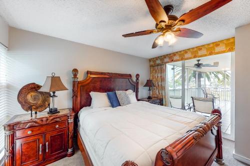 a bedroom with a bed and a ceiling fan at Duck Key Bliss in Duck Key