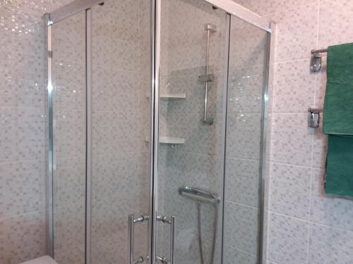 a shower with a glass door in a bathroom at MIRAMAR ATTICO in Morro del Jable