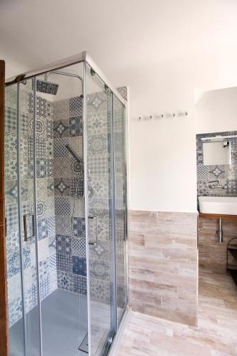 a shower with glass doors in a bathroom at Castè Style near Cinque Terre in Riccò del Golfo di Spezia