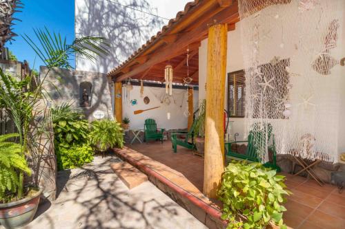 a house with a patio with plants on it at Villas del Santo Niño in Loreto