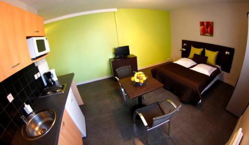 Katil atau katil-katil dalam bilik di Appart'hotel Les Palatines