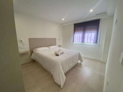 Apartamento Andalucía Centro tesisinde bir odada yatak veya yataklar