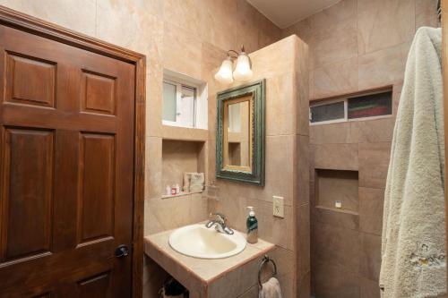 a bathroom with a sink and a mirror at Villas del Santo Niño in Loreto