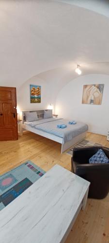 a living room with two beds and a couch at Ica House Central in Sibiu