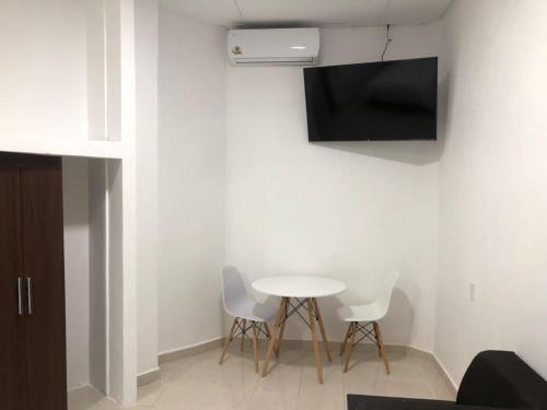 Televisyen dan/atau pusat hiburan di Hotel boutique turquesa