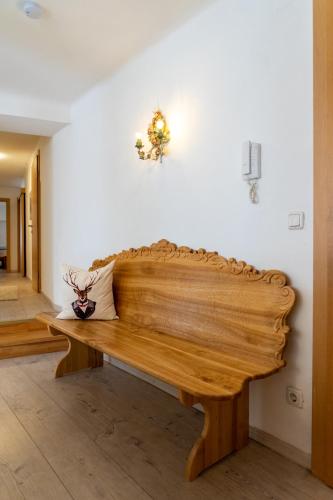 a wooden bench sitting in a room at Modern Apartment in the City Center of Bad Ischl in Bad Ischl