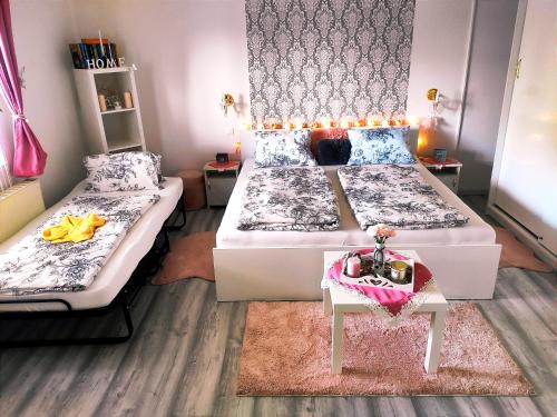 Кровать или кровати в номере Szandra Vendégház