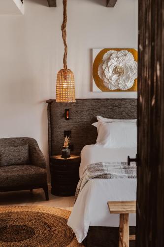 Кровать или кровати в номере Kaliva Suites - Adults Only