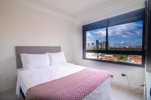 360 Vila Madalena tesisinde bir odada yatak veya yataklar