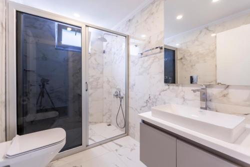 a bathroom with a toilet and a sink and a shower at LA VILLA CELINE- Luxury Sea View Villa with Private Infinity Pool in Islamlar-Kalkan in Kalkan