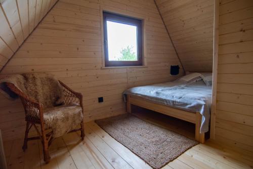 Giường trong phòng chung tại Domki w Wypoczywajce