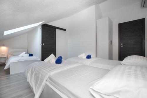 Postel nebo postele na pokoji v ubytování Apartments BlueView