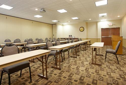 a classroom with rows of tables and chairs at Holiday Inn Express & Suites Deer Park by IHG in Deer Park