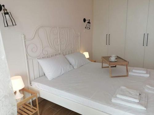 Ένα ή περισσότερα κρεβάτια σε δωμάτιο στο Atlas_Endless Blue Apartment