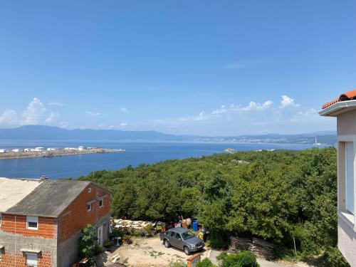 a view of a body of water from a building at Apartments Michael & Petra , Omisalj, Insel Krk, Kroatien in Omišalj