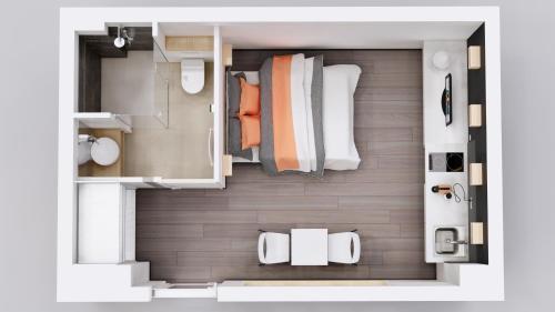 a rendering of a small apartment with a bedroom at Le 9ème- Métro Valmy-HomaLyon in Lyon