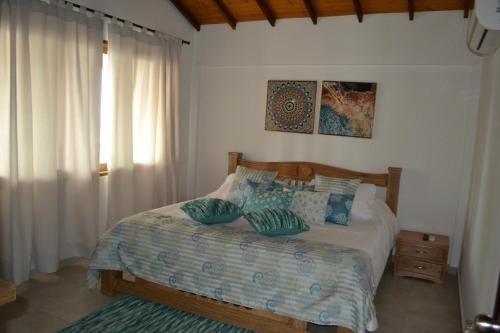 a bedroom with a bed with pillows on it at Condominio Atlantis in Coveñas