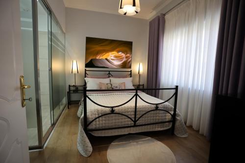 En eller flere senge i et værelse på Vila Essel