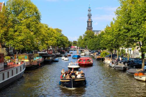 a group of people on a boat in a canal at Eelhouse private studio in Amsterdam