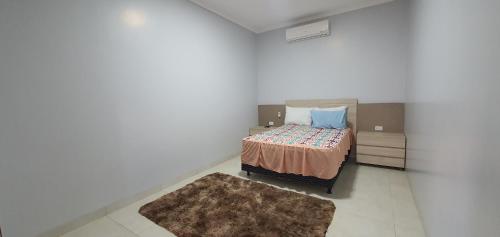 Кровать или кровати в номере Casa Temporada Aruanã Rio Araguaia