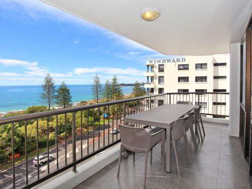 a balcony with a table and chairs and a view of the ocean at Stay 4 night Pay 3 nights only, during March 2026 in Mooloolaba